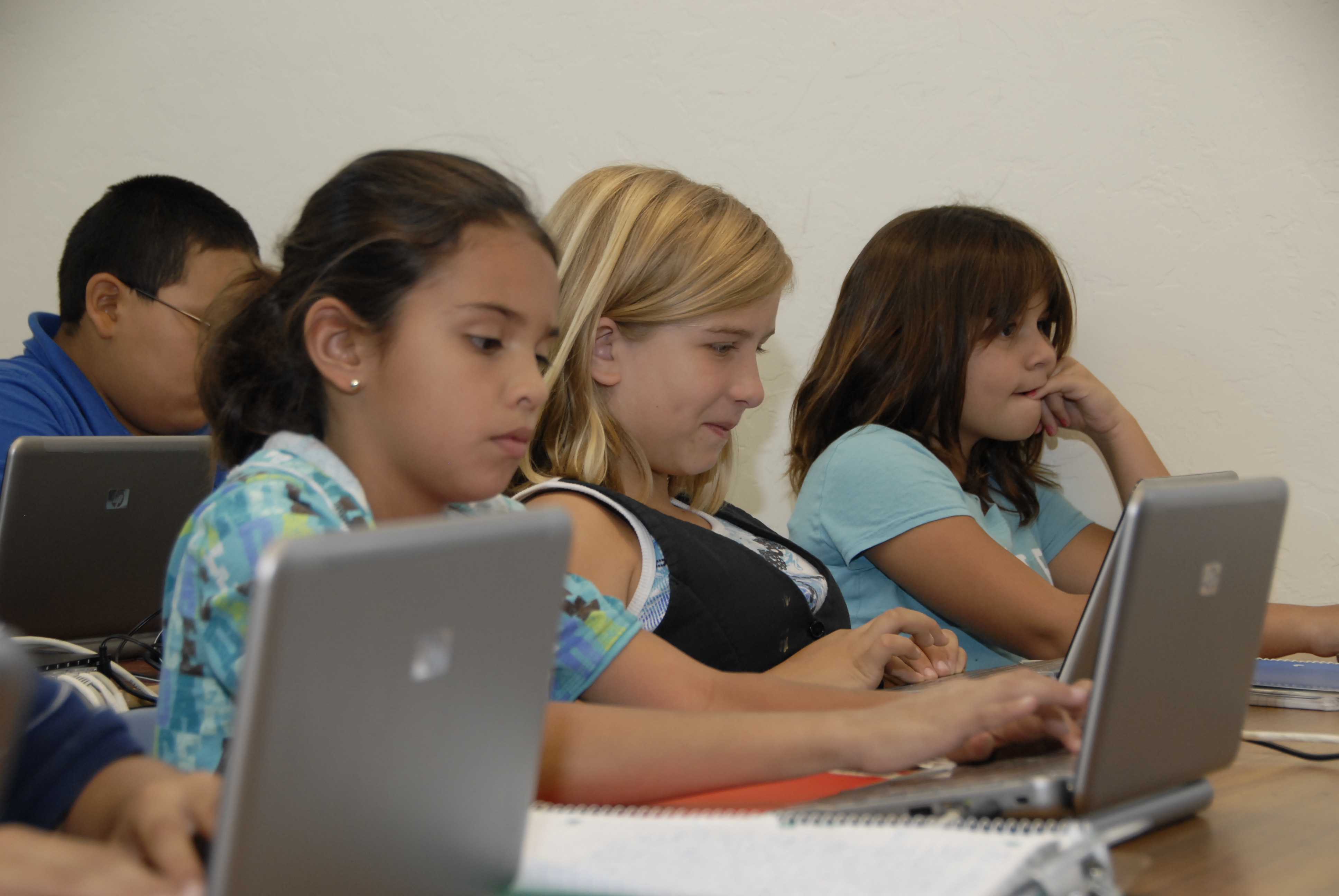 Students work on their laptops